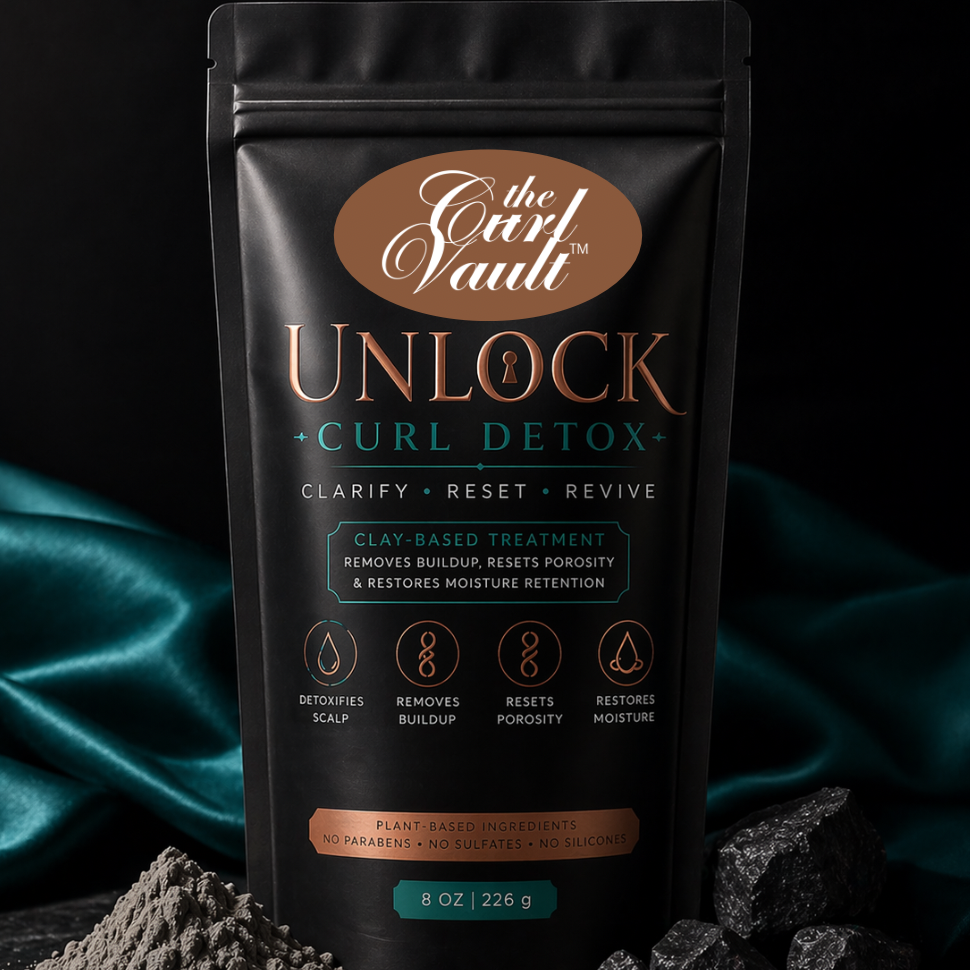Black packaging of 'The Curl Vault Unlock Curl Detox' product with text and branding on a dark background.